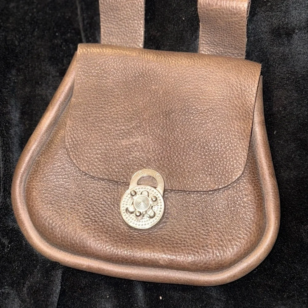 Brown Leather Backpack with Classic Design and Flap Closure